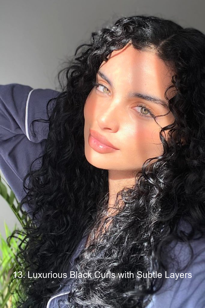 13. Luxurious Black Curls with Subtle Layers