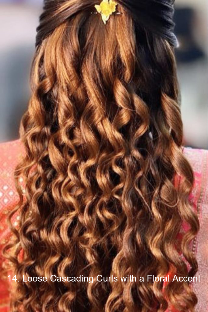 14. Loose Cascading Curls with a Floral Accent