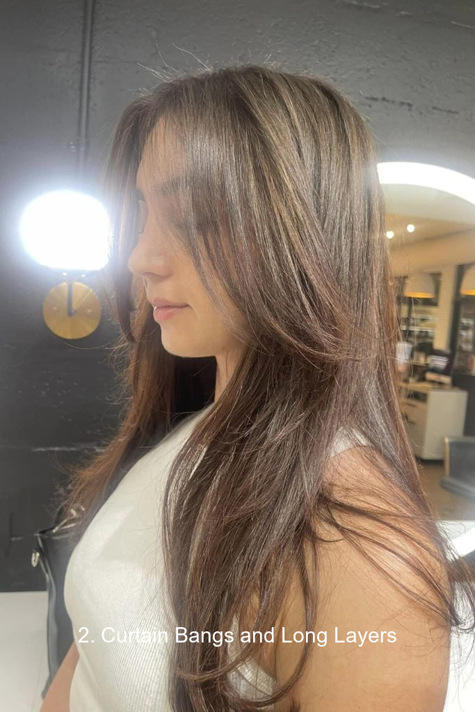 2. Curtain Bangs and Long Layers