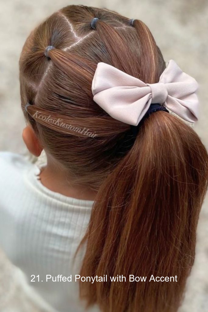 21. Puffed Ponytail with Bow Accent