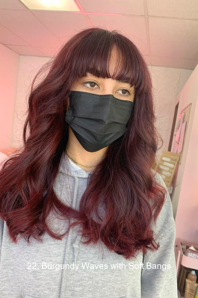 22. Burgundy Waves with Soft Bangs