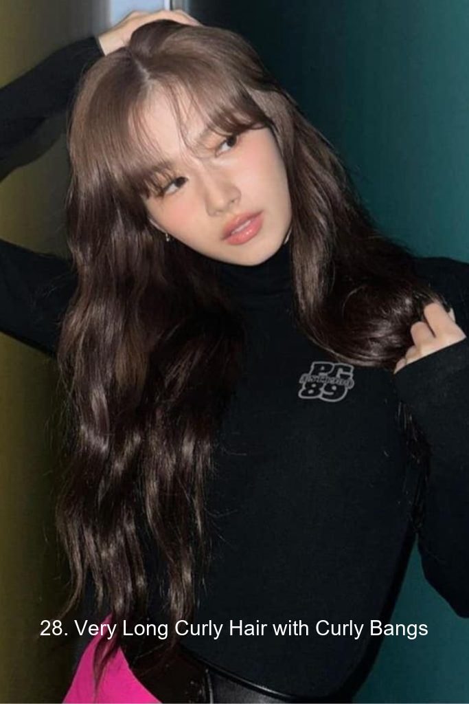 28. Very Long Curly Hair with Curly Bangs