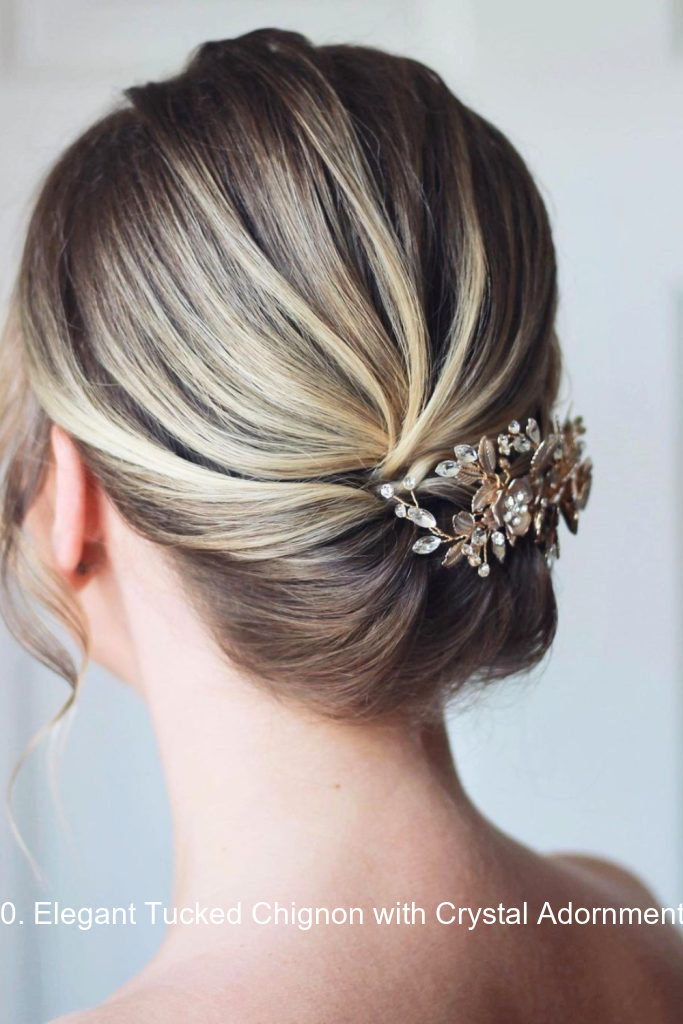 30. Elegant Tucked Chignon with Crystal Adornments