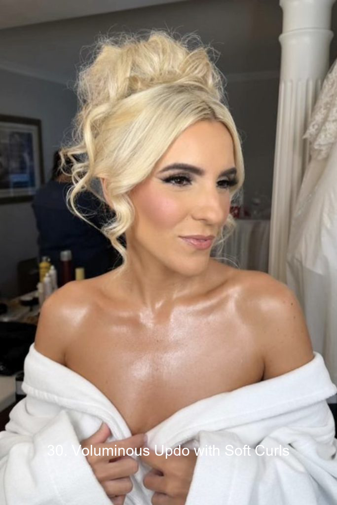 30. Voluminous Updo with Soft Curls