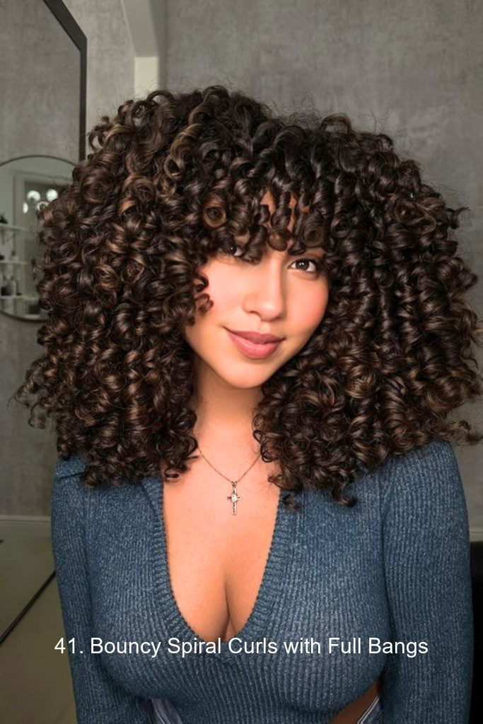 41. Bouncy Spiral Curls with Full Bangs