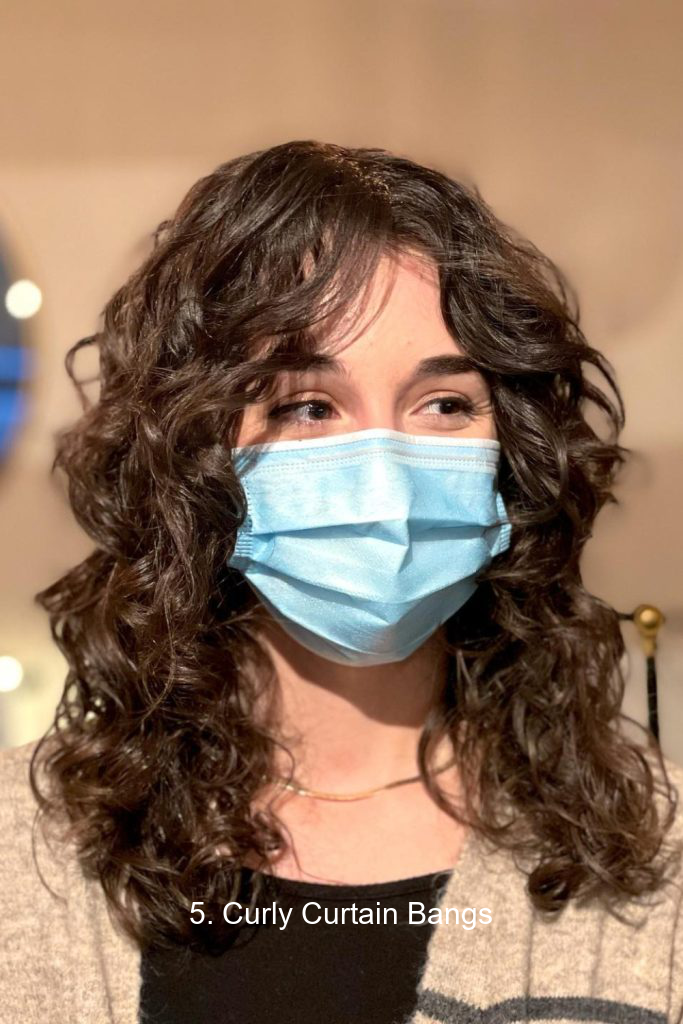 5. Curly Curtain Bangs