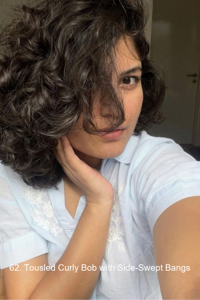 62. Tousled Curly Bob with Side-Swept Bangs
