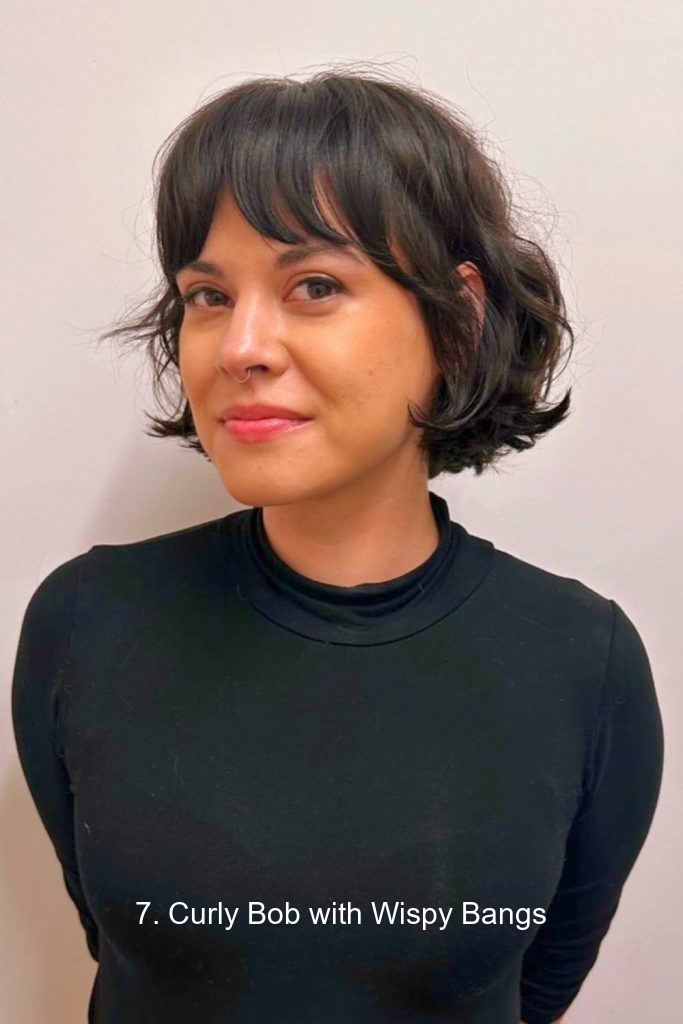 7. Curly Bob with Wispy Bangs